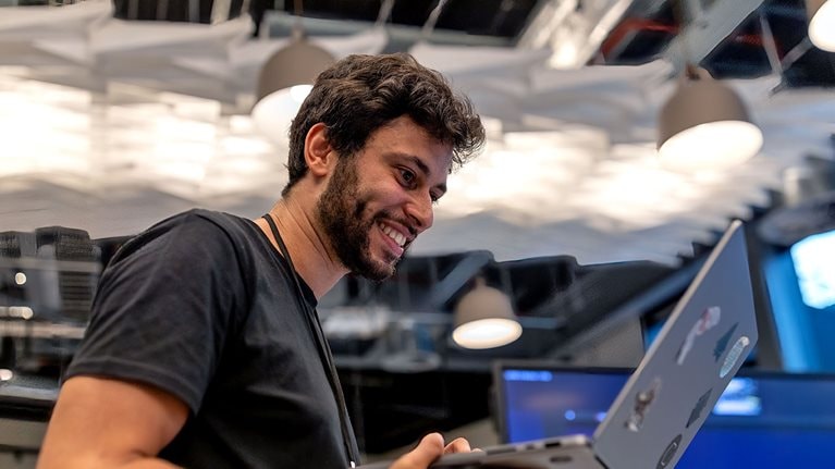 Joel Schwarzmann, a product manager for QuantumBlack Labs, working on a laptop